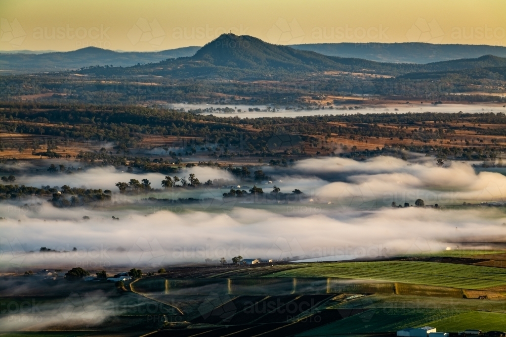 low foggy cloud over rural farming scene - Australian Stock Image