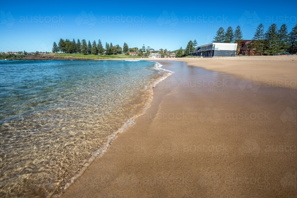 Low shot of a beach at the edge of the water - Australian Stock Image