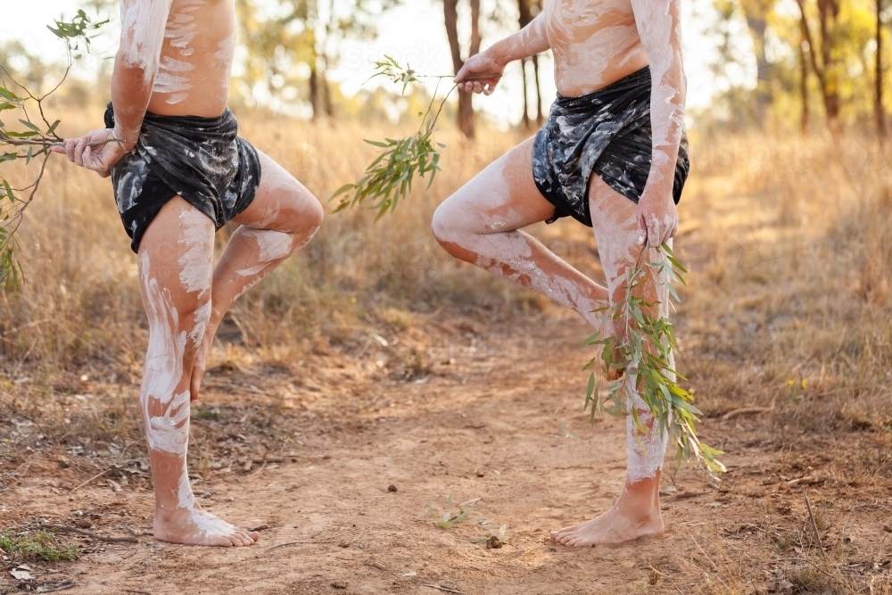 lower body shot of aboriginal dancers in lap lap clothes and traditional  body paint - Australian Stock Image