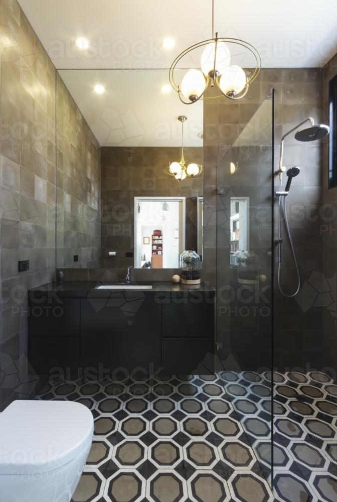 Luxury designer bathroom in contemporary new home extension in dark masculine tones - Australian Stock Image