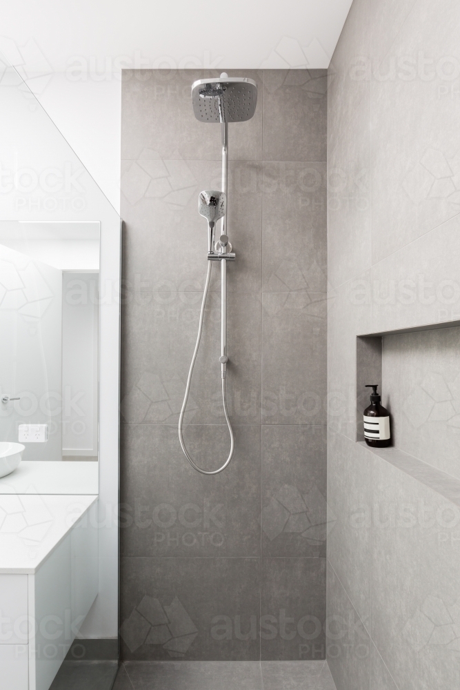 Luxury fully tiled shower with rain head and hand held shower rose - Australian Stock Image