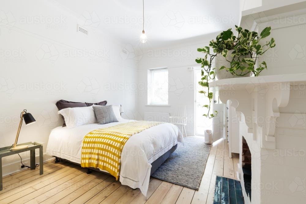 Luxury guest bedroom in vintage scandi styled Australian home - Australian Stock Image