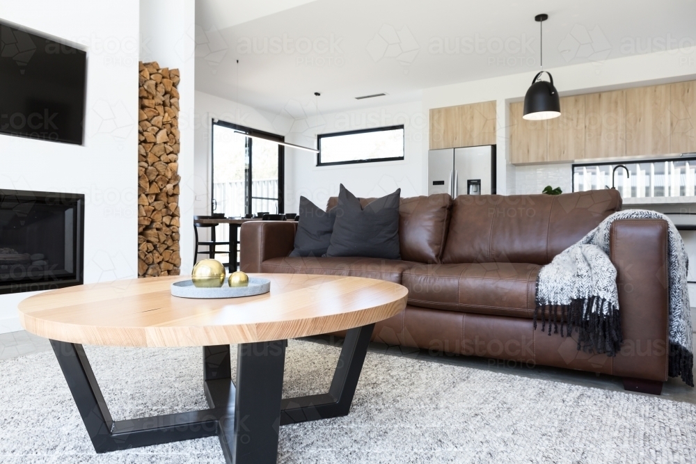 Luxury living room with leather sofa and oak coffee table - Australian Stock Image