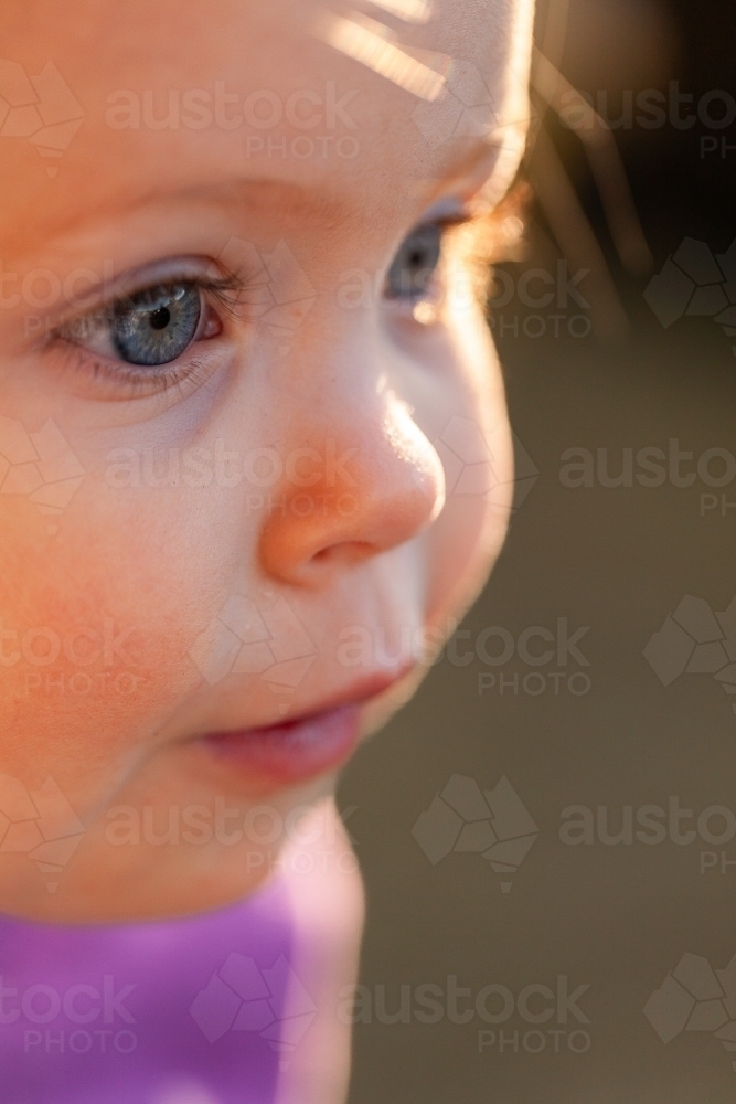 Macro close up of toddler girls eye in side profile - Australian Stock Image