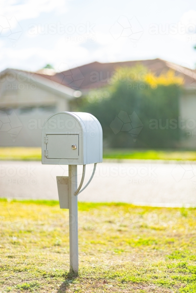 Mailbox beside road in town - Australian Stock Image