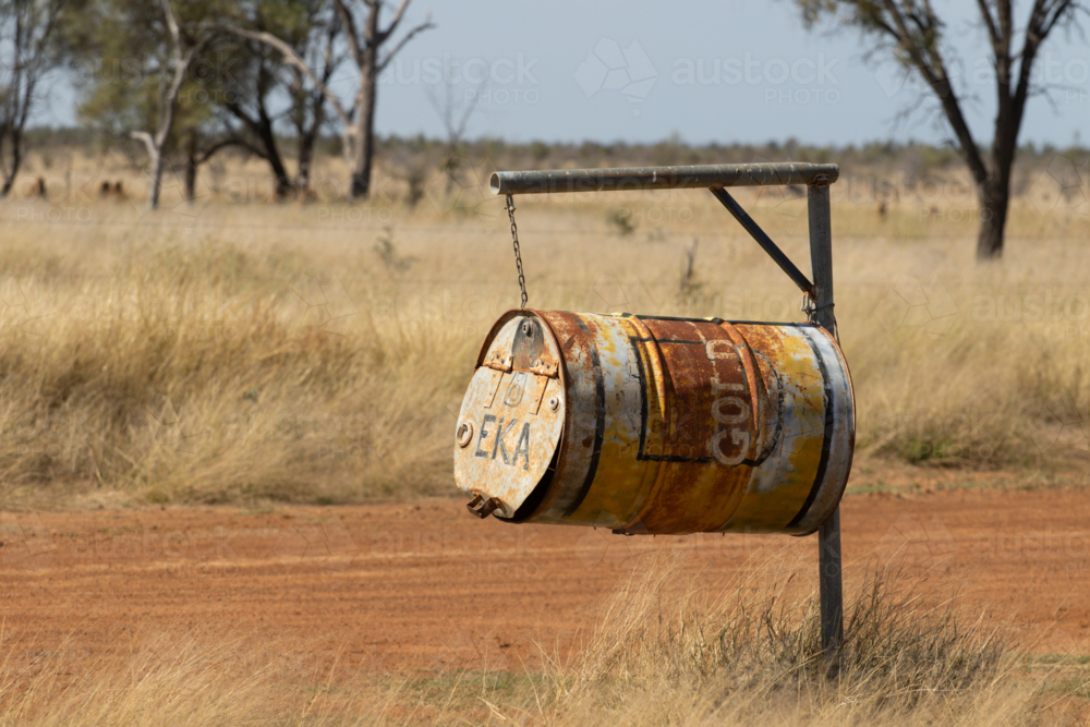 Mailbox made from a 200lt drum on a dirt road - Australian Stock Image
