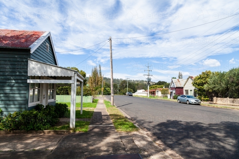 Main street of tiny rural country town in Australia with old buildings and one parked car - Australian Stock Image