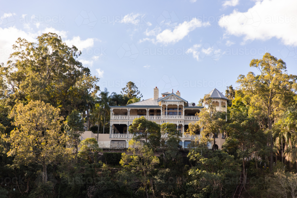 majestic stately home surrounded by gum trees - Australian Stock Image