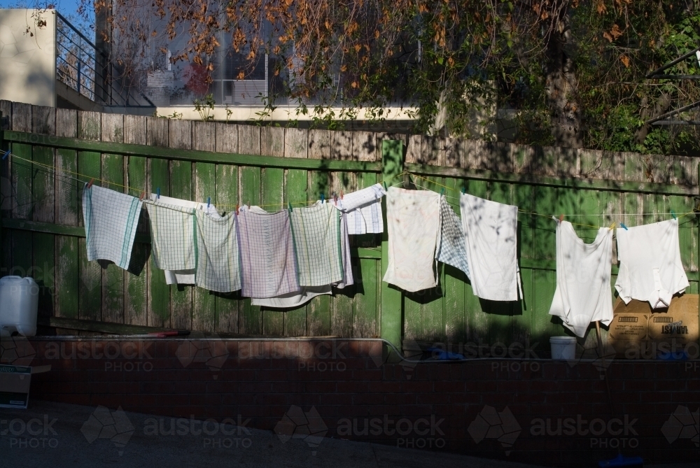 Makeshift clotheslines behind a cafe - Australian Stock Image