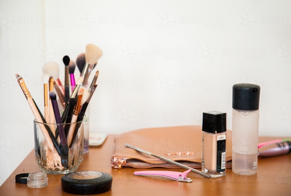Makeup artist's brushed sitting on table - Australian Stock Image