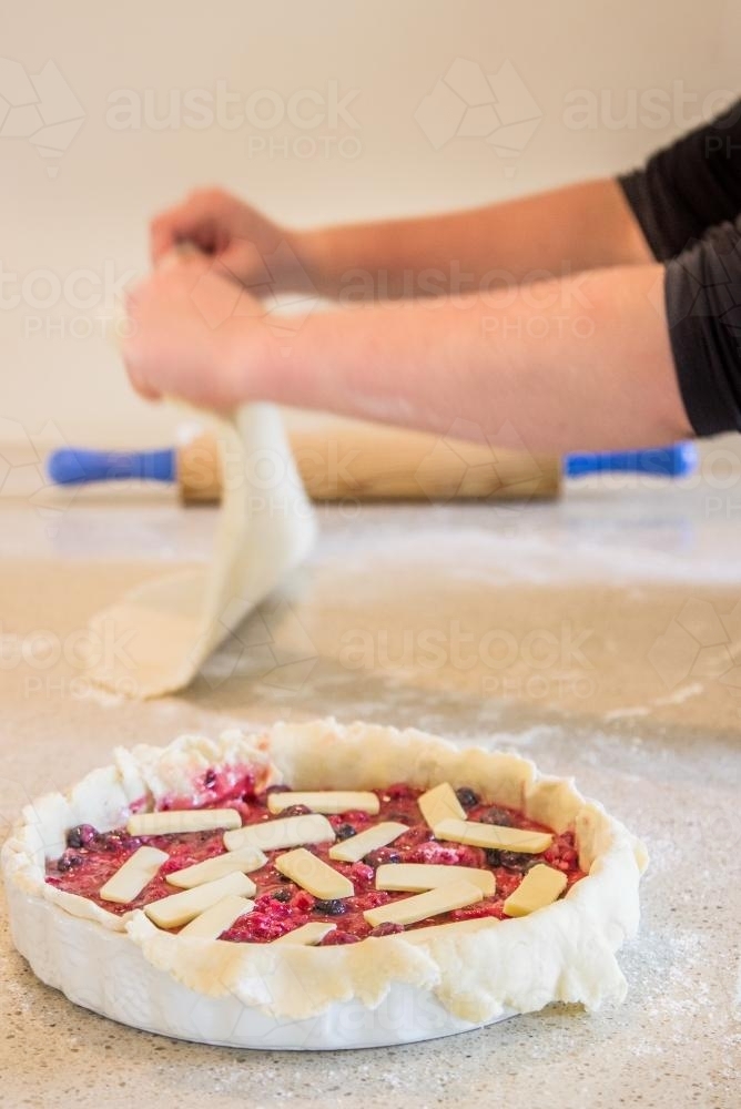 Making homemade pastry and berry pie - Australian Stock Image