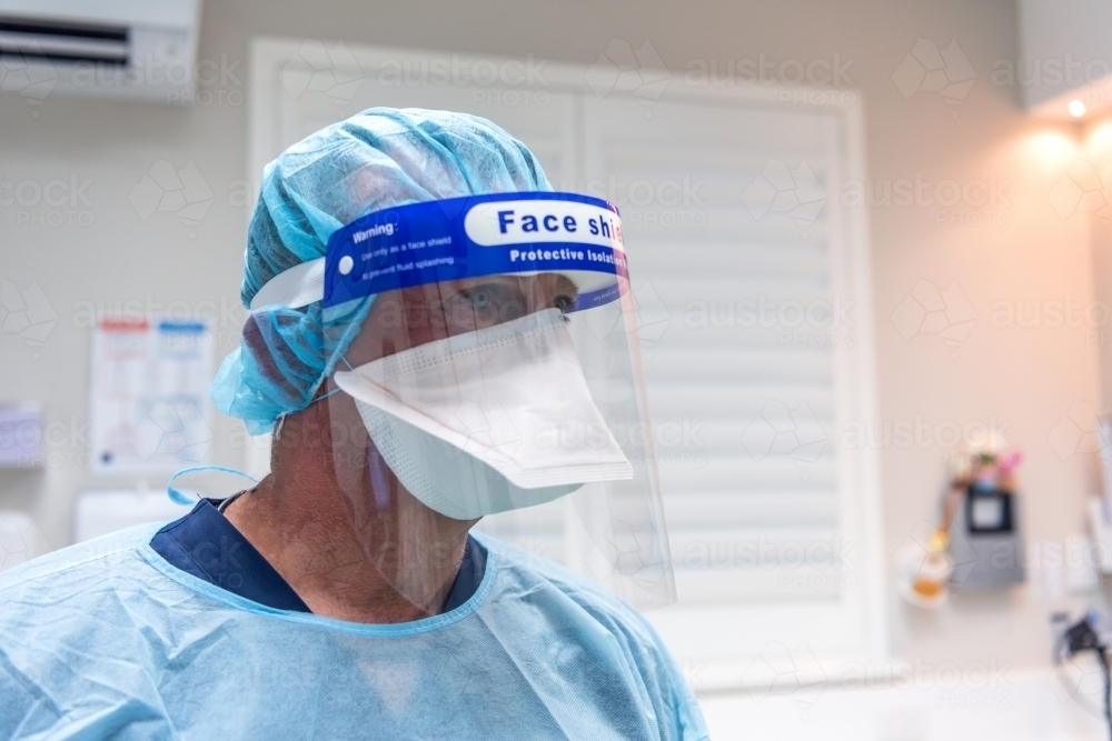 Male dentist wearing dental PPE - Australian Stock Image