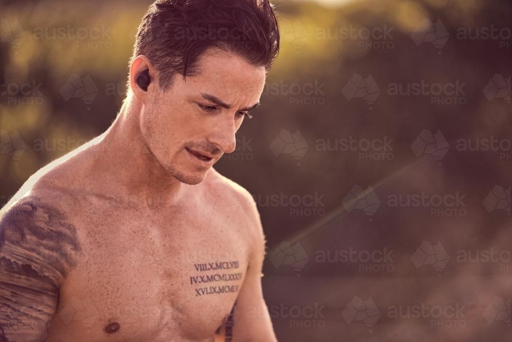 Male person exercising in the morning with workout routine - Australian Stock Image