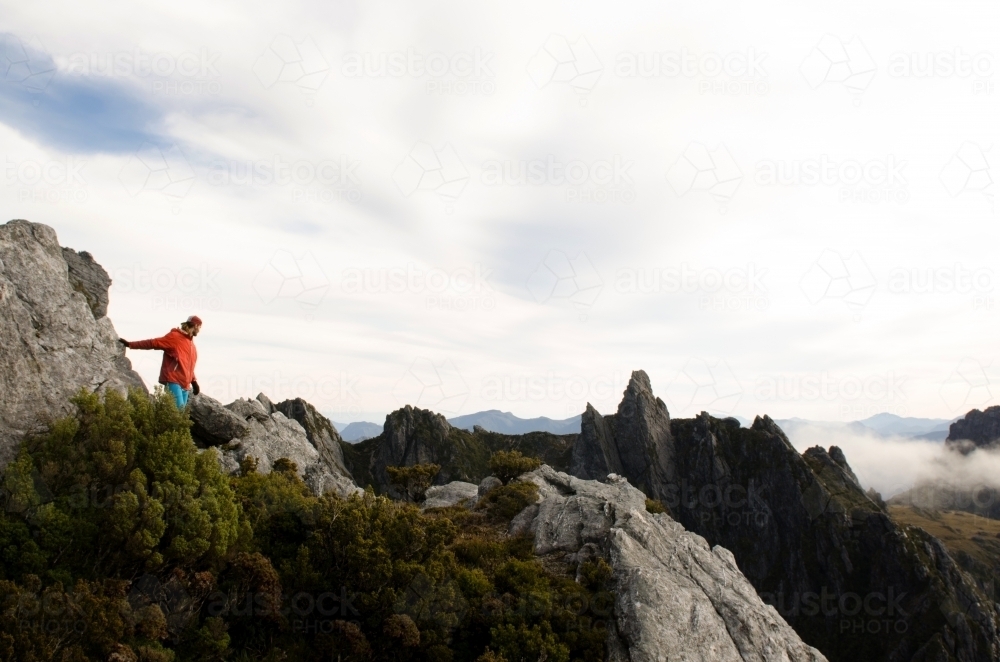 Man alone on mountainscape - Australian Stock Image