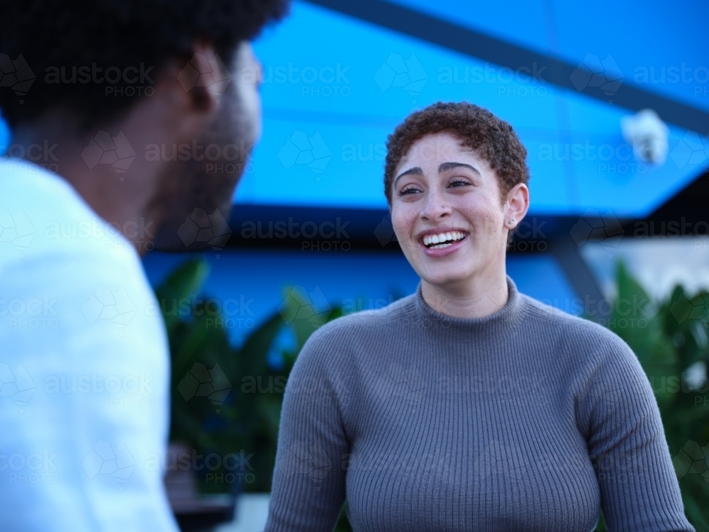 Image of Man and woman having a conversation outside - Austockphoto