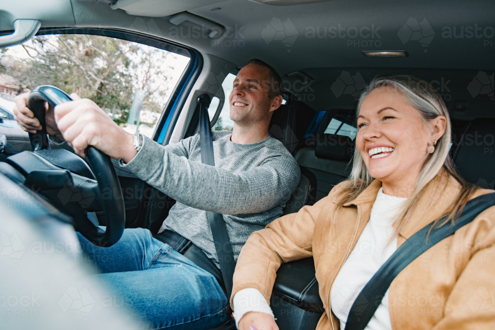 Man and woman travelling in a car together - Australian Stock Image