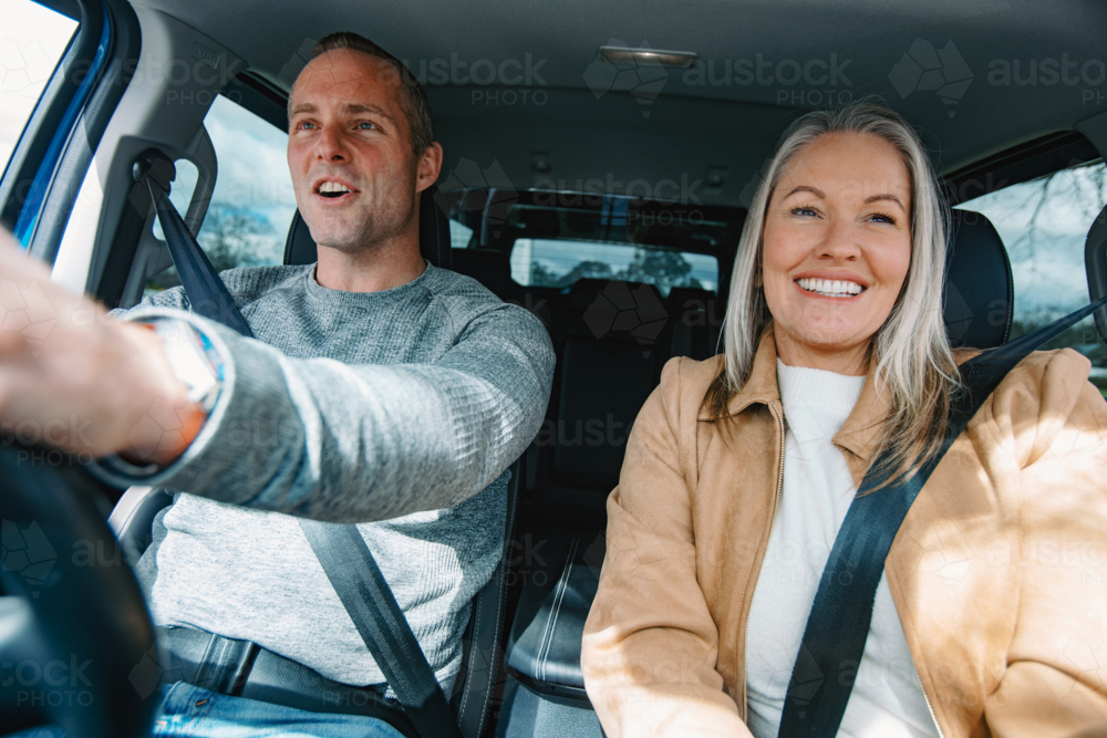 Man and woman travelling in a car together - Australian Stock Image