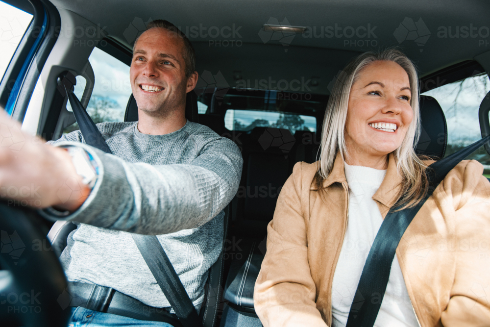 Man and woman travelling in a car together - Australian Stock Image