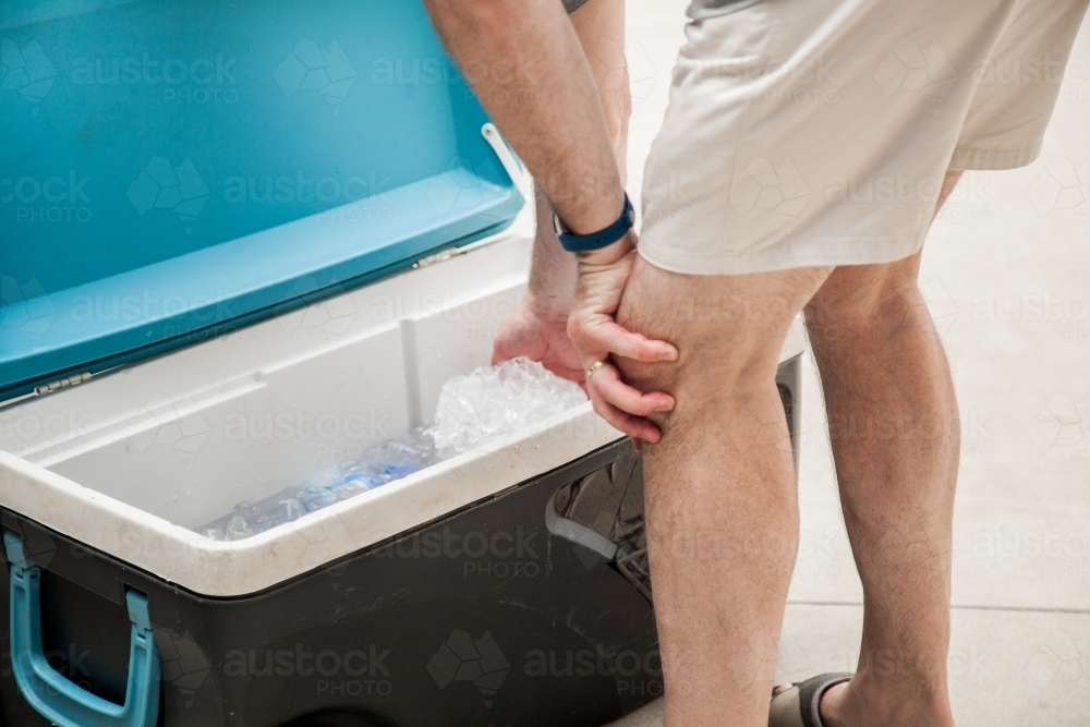 Image Of Man Bending Over Open Esky Box Austockphoto