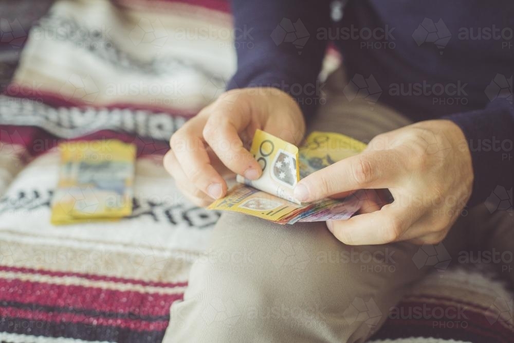 Man Counting 50 Dollar Notes - Australian Stock Image