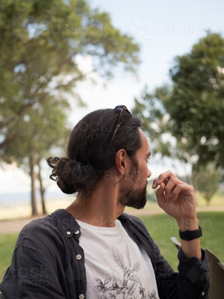 Man deep in thought surrounded by nature - Australian Stock Image
