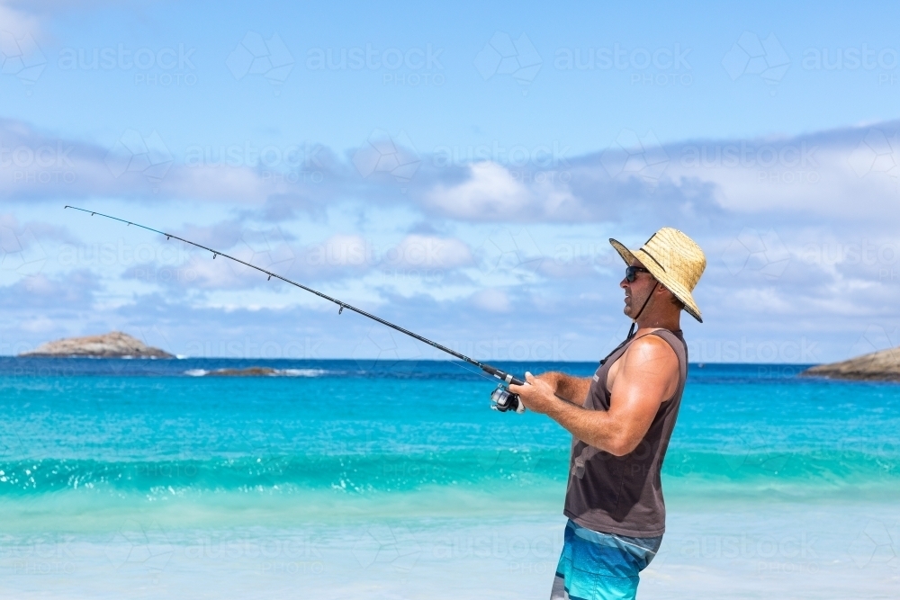 man fishing on the beach - Australian Stock Image