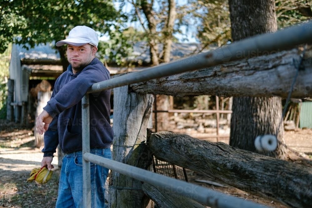 Man Holding open Farm Gate - Australian Stock Image