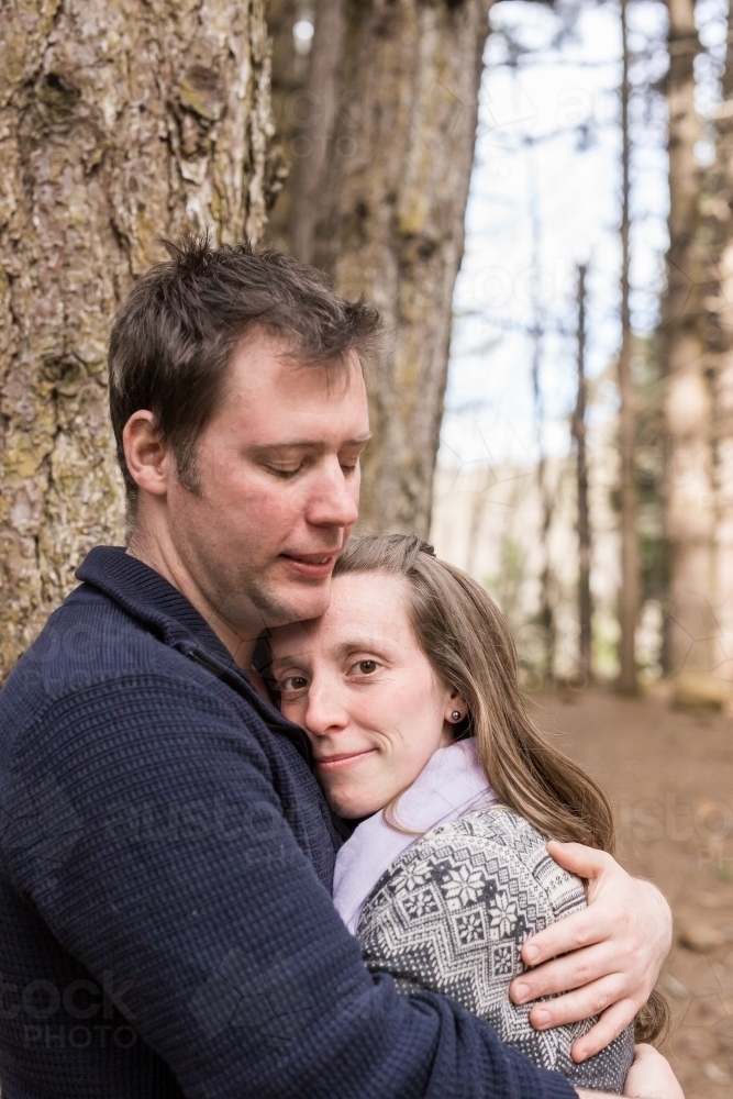 Man holding woman in a close embrace - Australian Stock Image