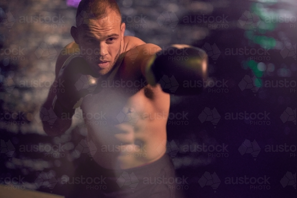 Man in urban city boxing fitness training - Australian Stock Image