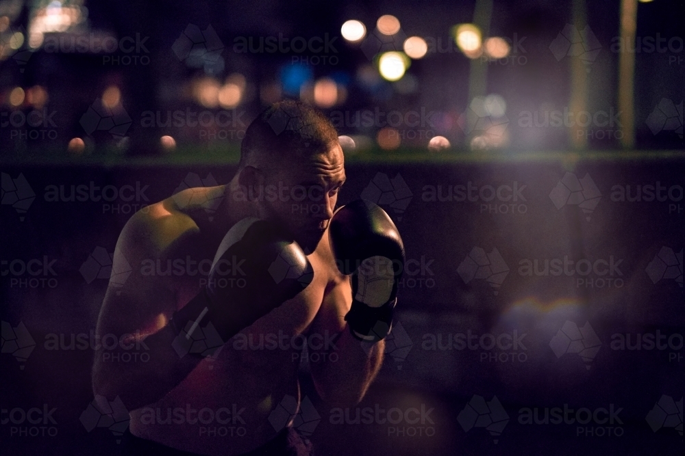Man in urban city boxing fitness training - Australian Stock Image