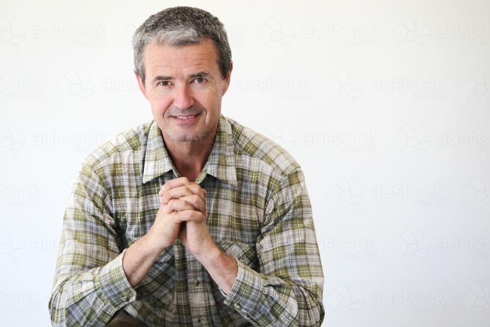 Man in work clothes on white - Australian Stock Image