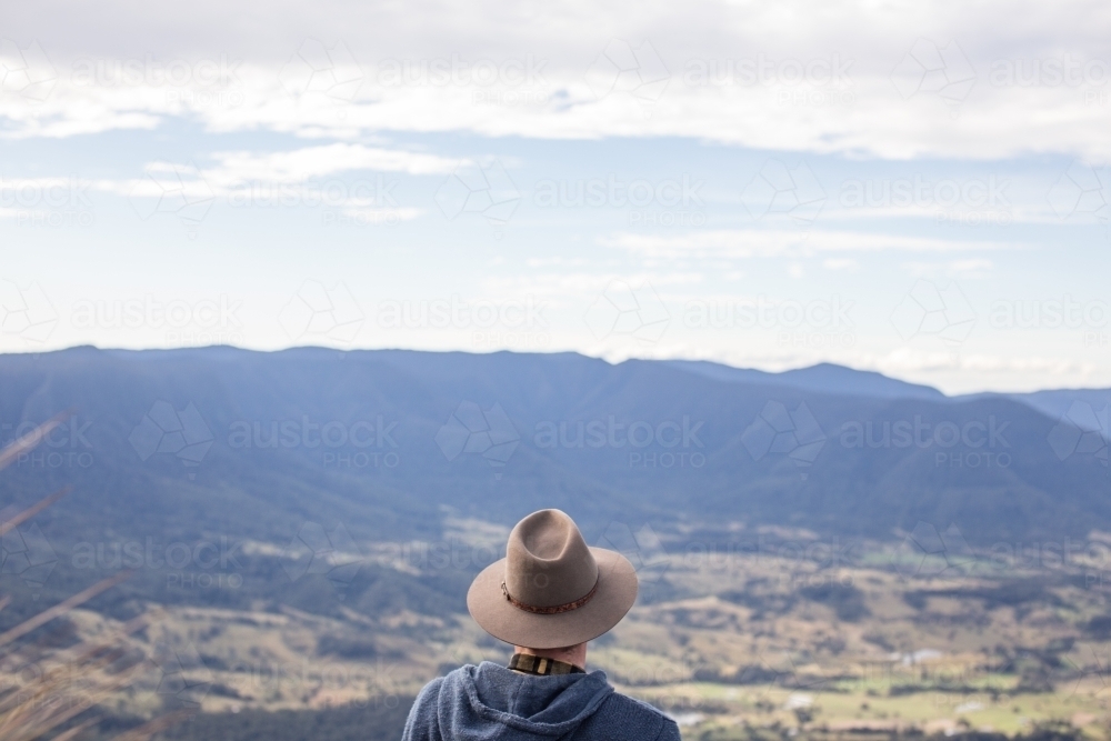Man looking over Australian landscape - Australian Stock Image
