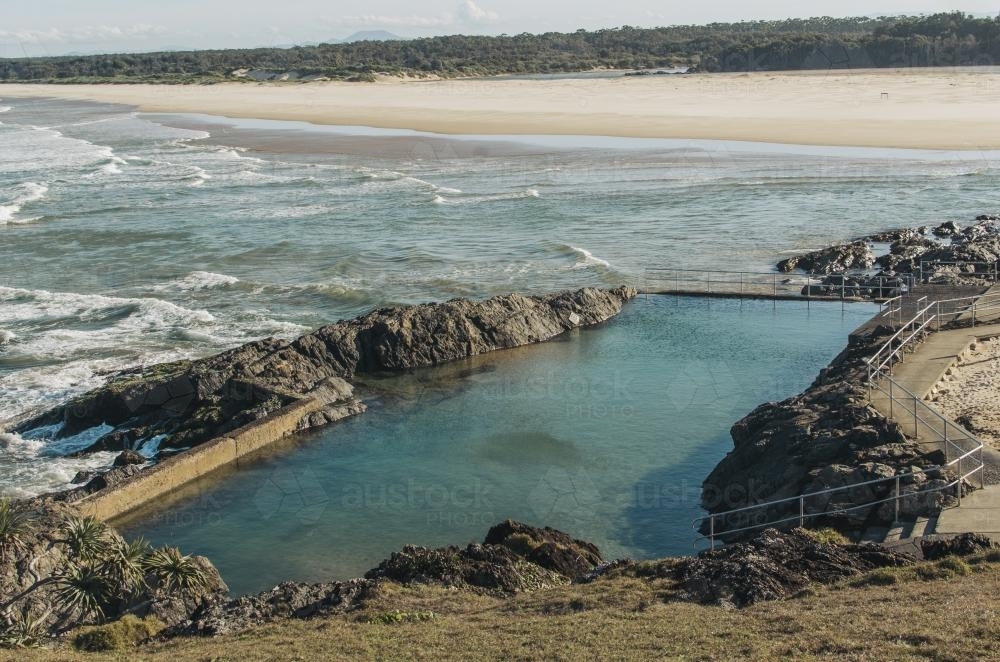 Man made swimming pool by ocean - Australian Stock Image