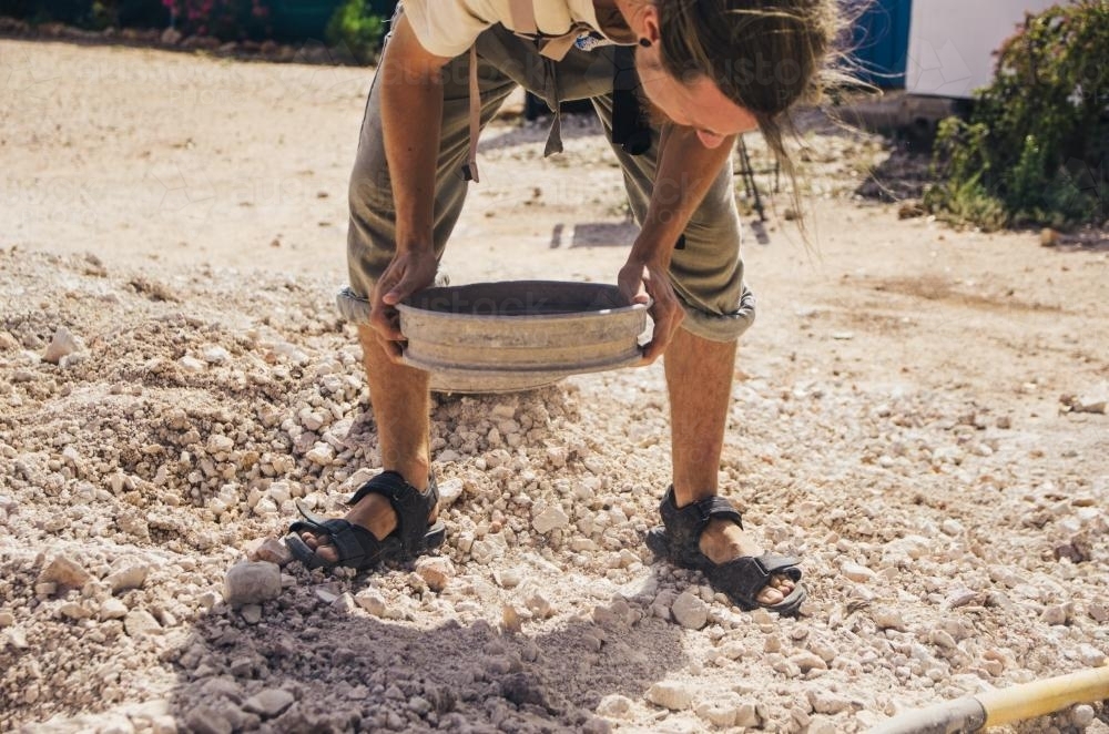 Man panning for opals - Australian Stock Image