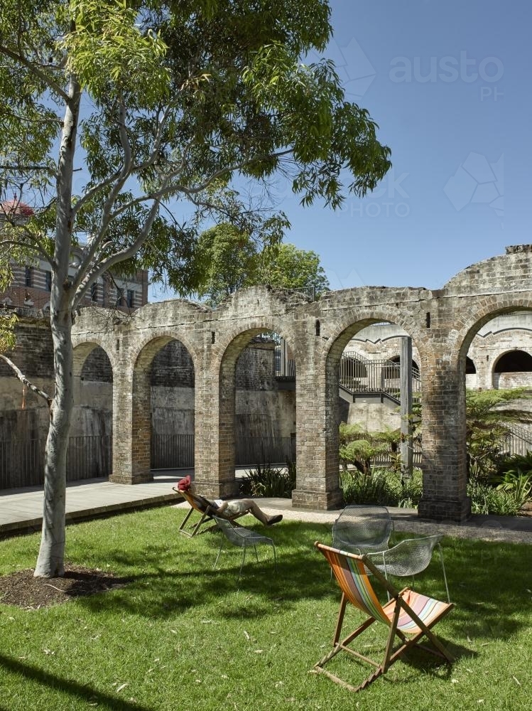 man relaxing at Paddington Reservoir - Australian Stock Image