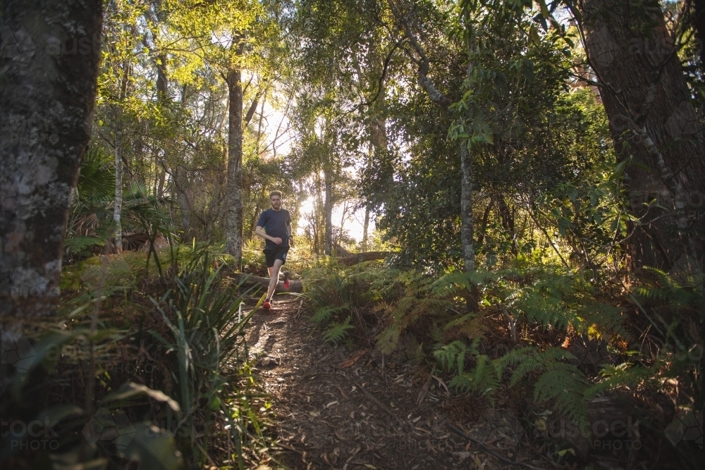 Man running in bush - Australian Stock Image