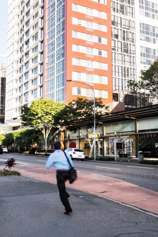 man running late for the bus or work - Australian Stock Image