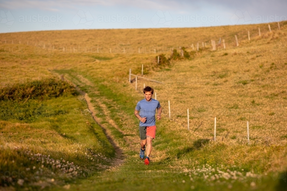 Man Running Towards Camera in Countryside - Australian Stock Image