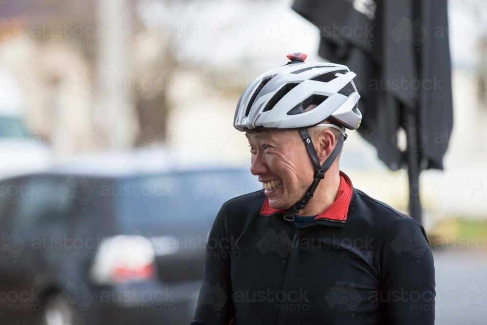 Man smiling after returning from a bike ride - Australian Stock Image