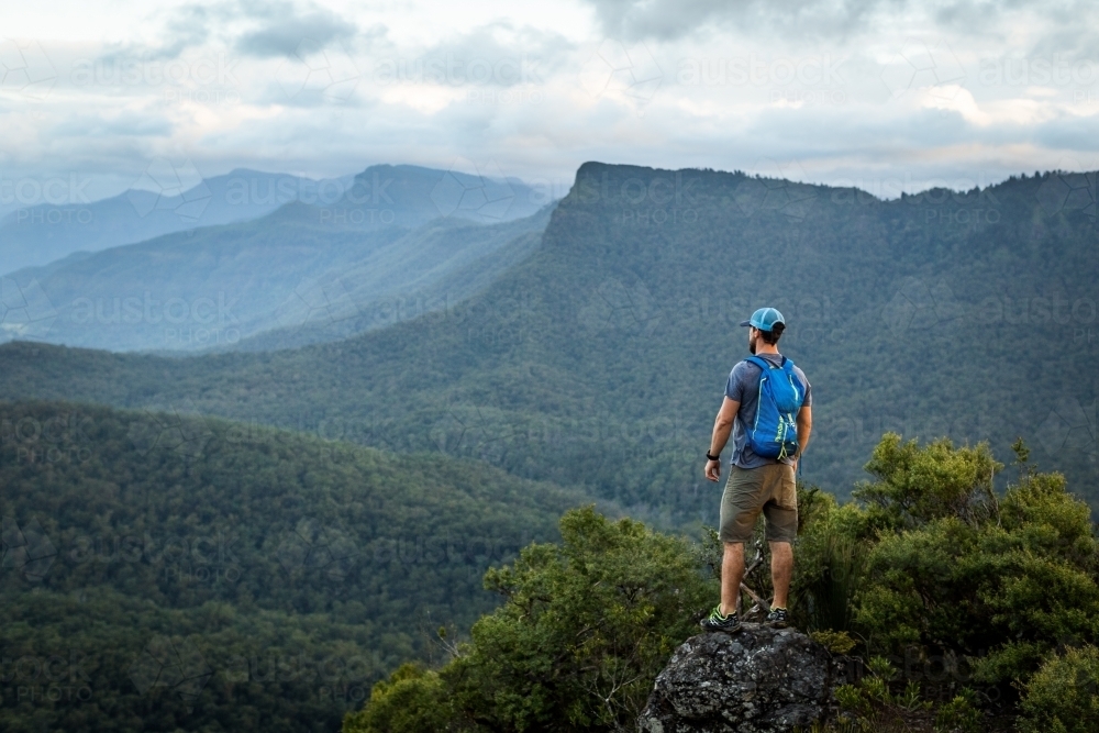 Man standing on Mountain top - Australian Stock Image