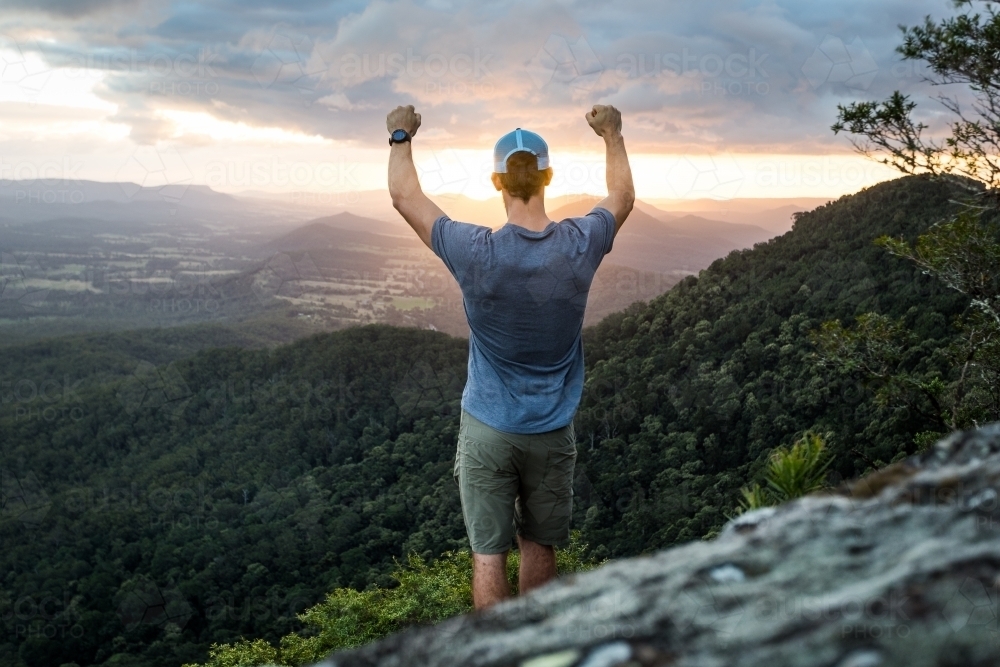 Man standing on Mountain top - Australian Stock Image