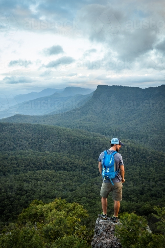 Man standing on Mountain top - Australian Stock Image
