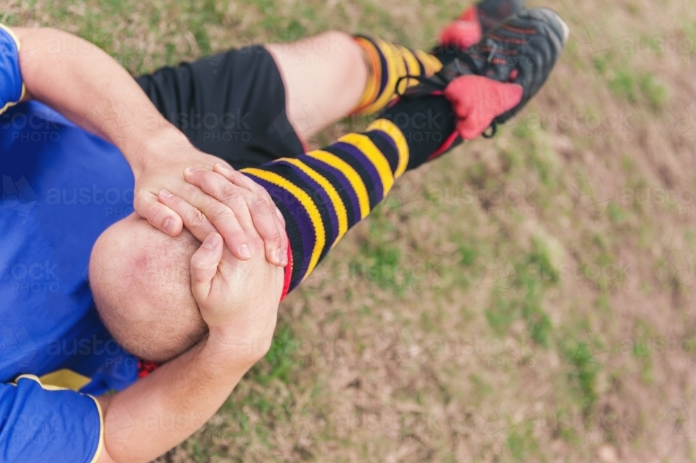 Man stretching before a soccer game - Australian Stock Image