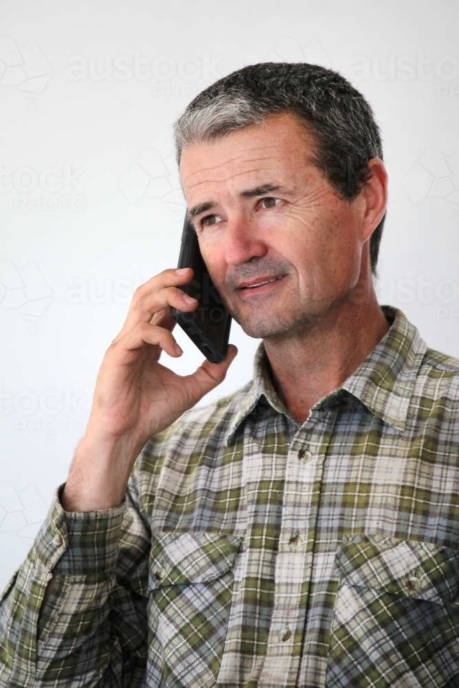 Man talking on mobile phone - Australian Stock Image