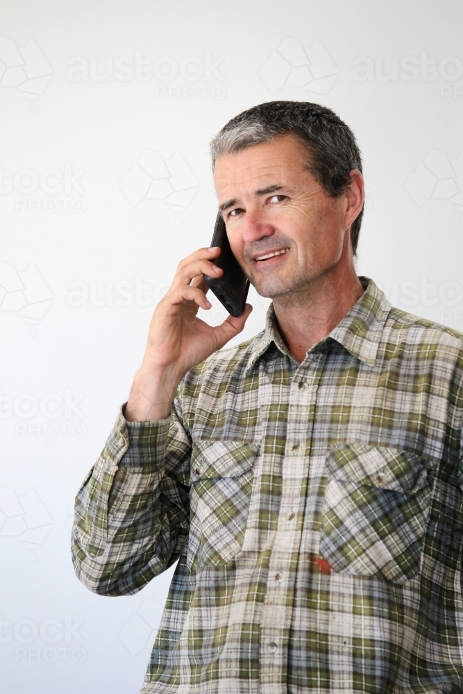 Man talking on mobile phone - Australian Stock Image