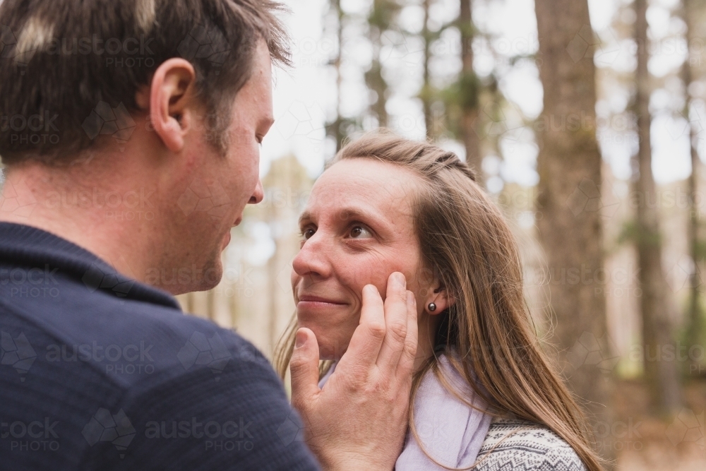 Man touching woman face lovingly - Australian Stock Image
