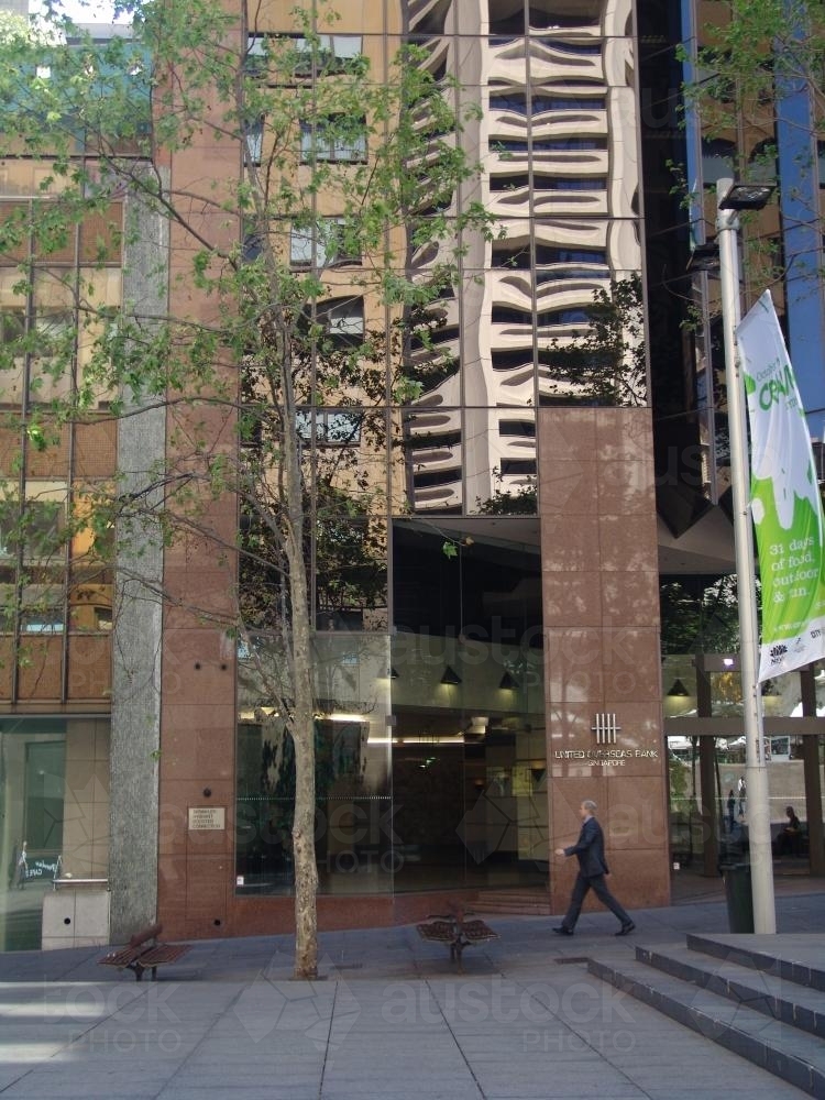 Man walking past buildings in Martin Place - Australian Stock Image