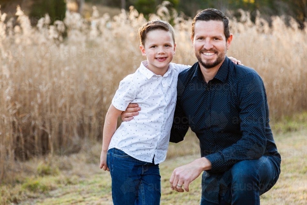 Man with his son smiling together for a portrait - Australian Stock Image