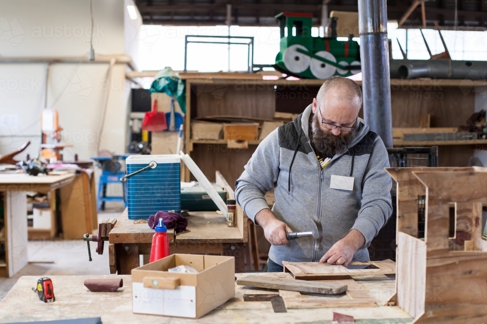 Man working on a project at a men's shed - Australian Stock Image