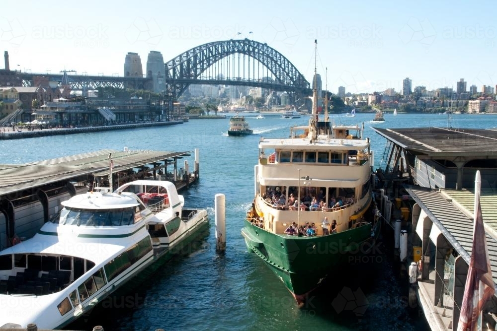 Image Of Manly Ferry At Circular Quay With Harbour Bridge In The image-of-manly-ferry-at-circular-quay-with-harbour-bridge-in-the